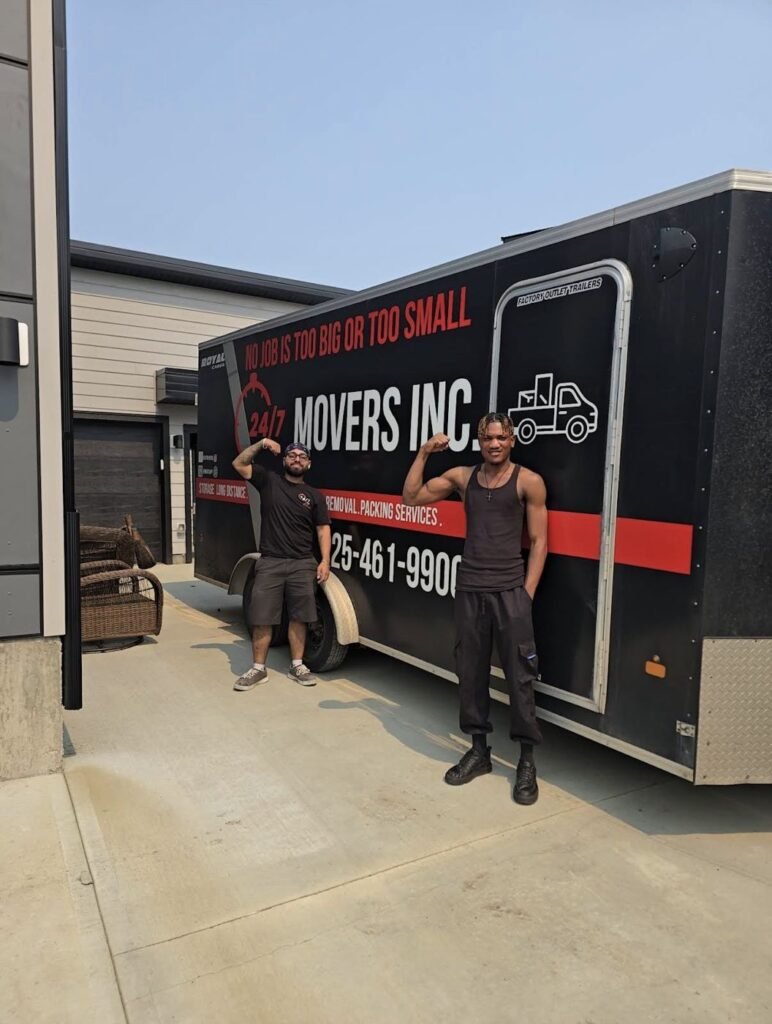 247 Movers Inc. crew beside the company's branded moving trailer