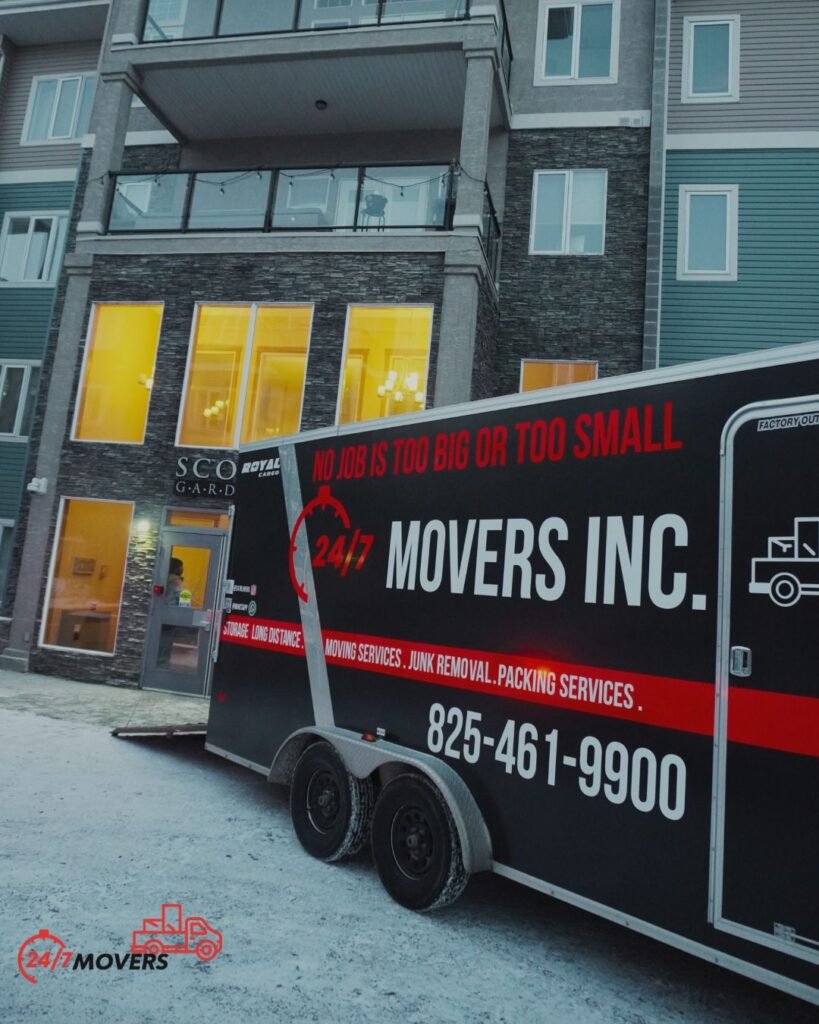 247 Movers Inc. branded trailer outside an Edmonton condo in winter