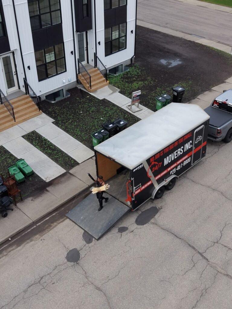 247 Movers Inc. branded trailer loading at an Edmonton townhouse
