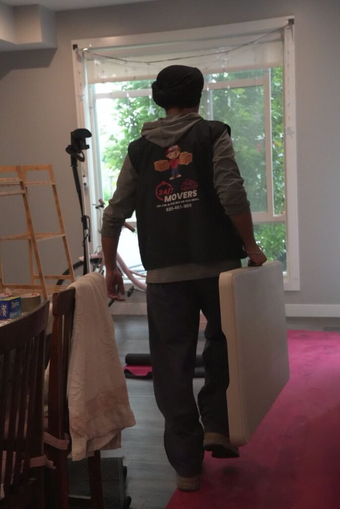 Mover walking over floor runner protection inside an apartment