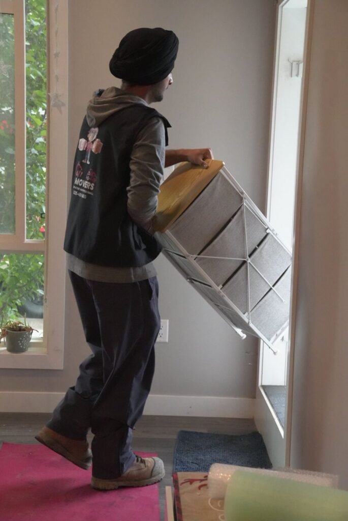 Mover guiding furniture through a tight condo doorway
