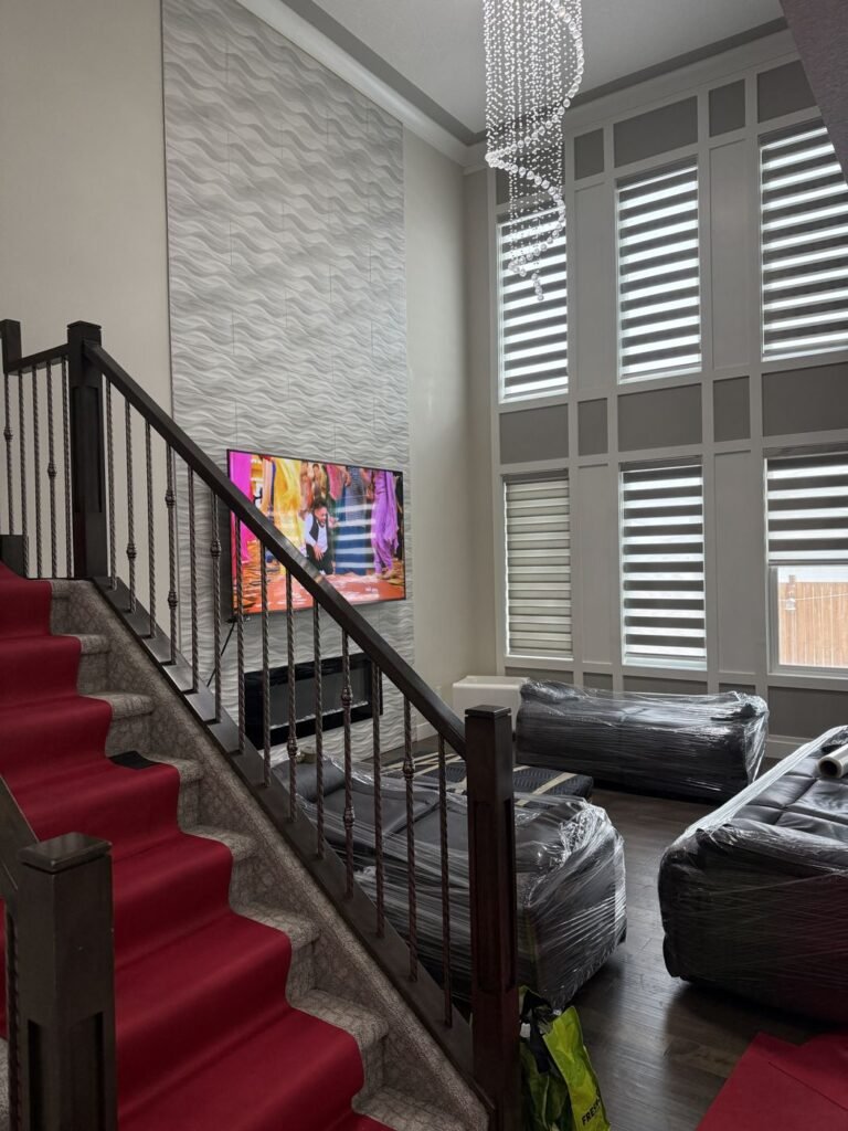 Shrink-wrapped sofas with stairs protected by floor runners